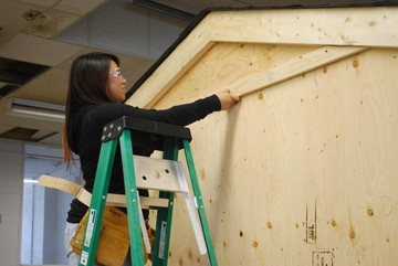 Teryn Laboucan, Little Buffalo School, helping to build an ice fishing shack at the 2014 Career Explorations Camp in Grouard