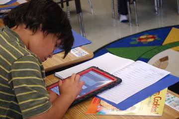 Marcus Thomson, Susa Creek School, practicing his spelling on the iPad