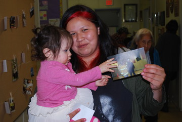 Jenni McDonald, former student, holding onto a past picture with her daughter Serenity!