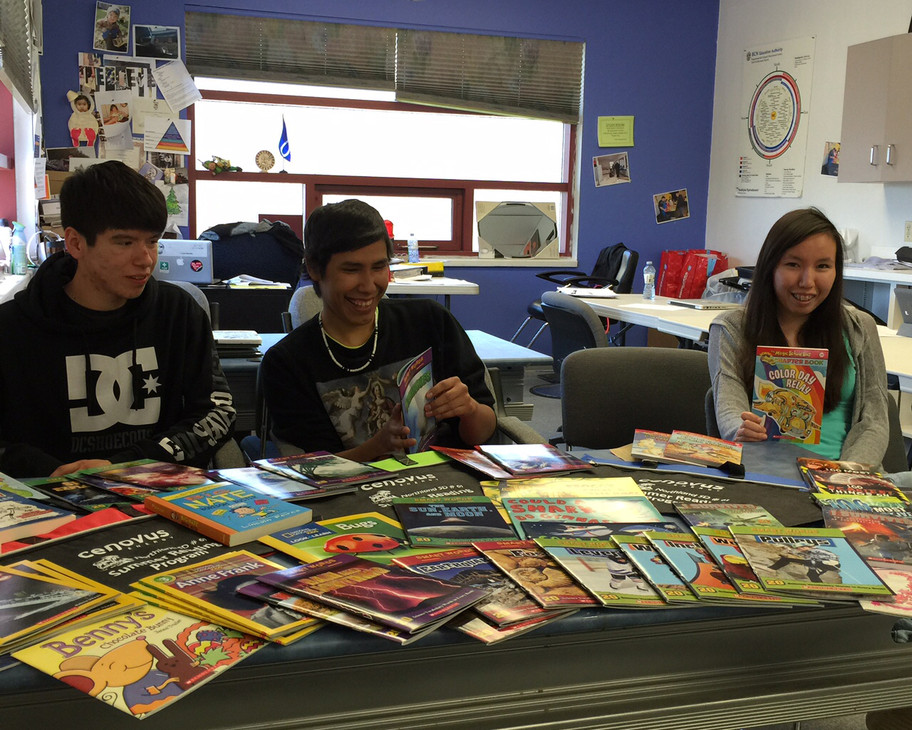 Career Pathway School students review some of the books for Summer Reading Program