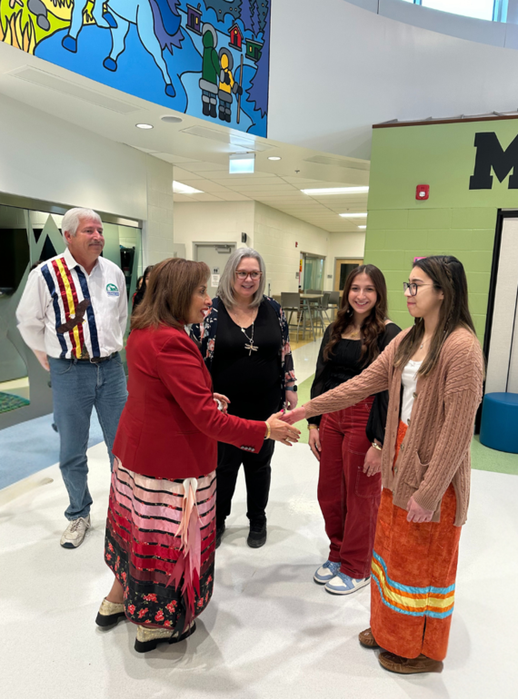 Lieutenant Governor interacting with trustee, staff and students