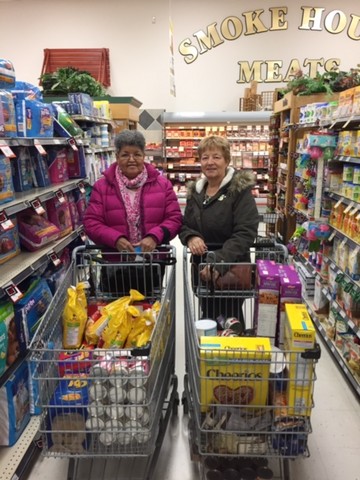 Left to Right: Louisa Alexie and Marj Lubber purchase groceries for Salvation Army Food Bank in Peace River! 